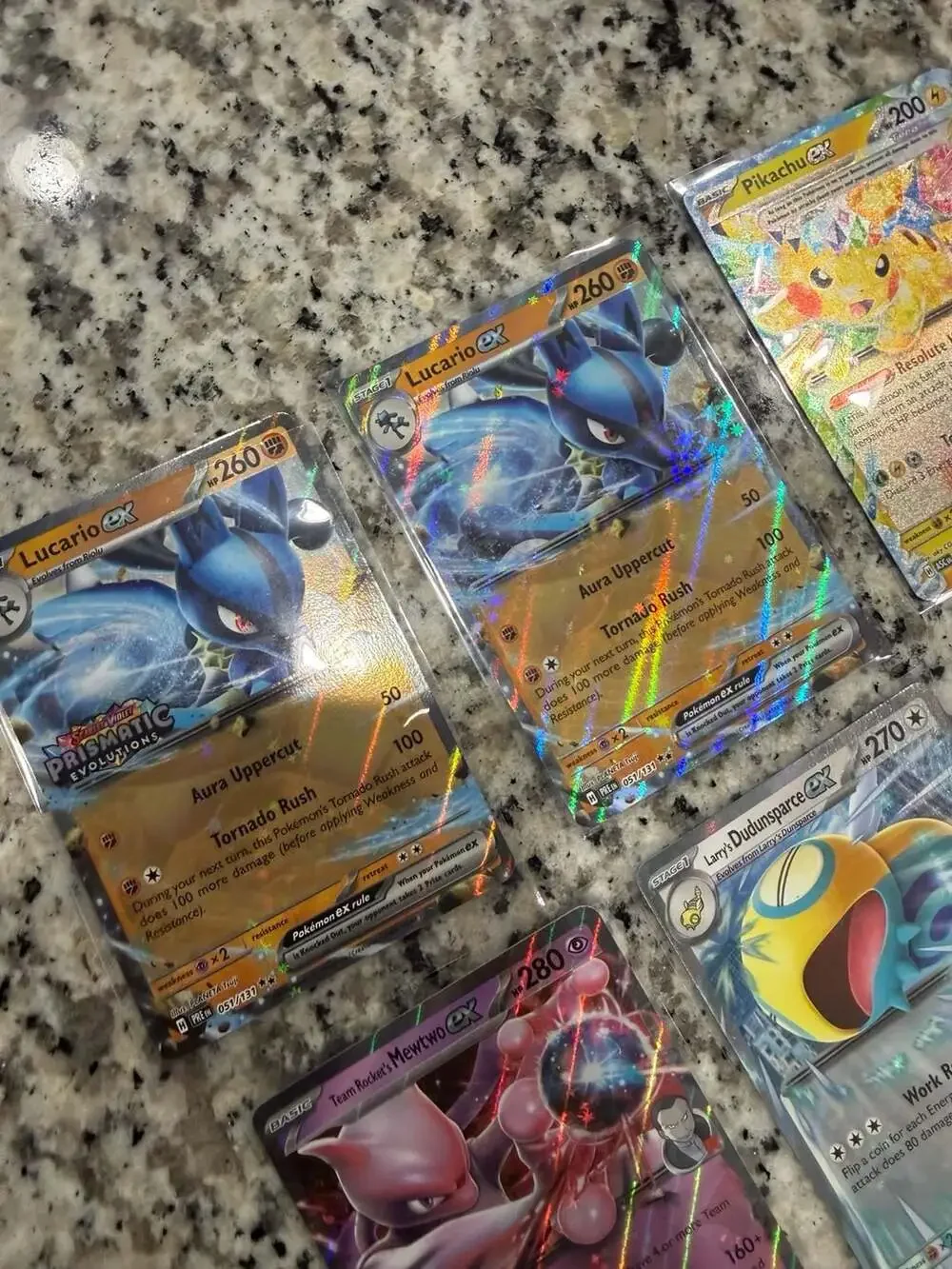 Lot of 9 Assorted Pokémon Trading Cards featuring EX, V, and Tera variants